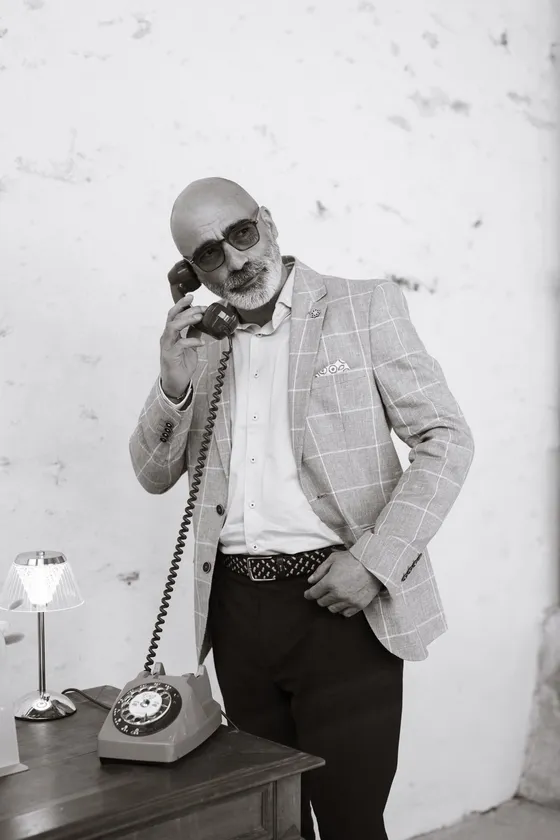 Guest on the vintage phone, black and white photo