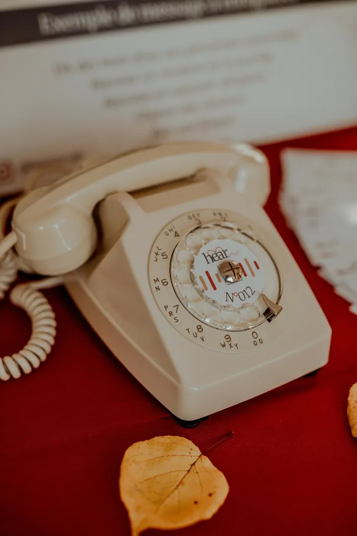 Ivory HearMe phone on a red tablecloth